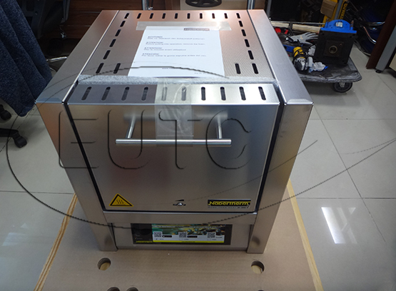 Electrically heated muffle furnace with flap door